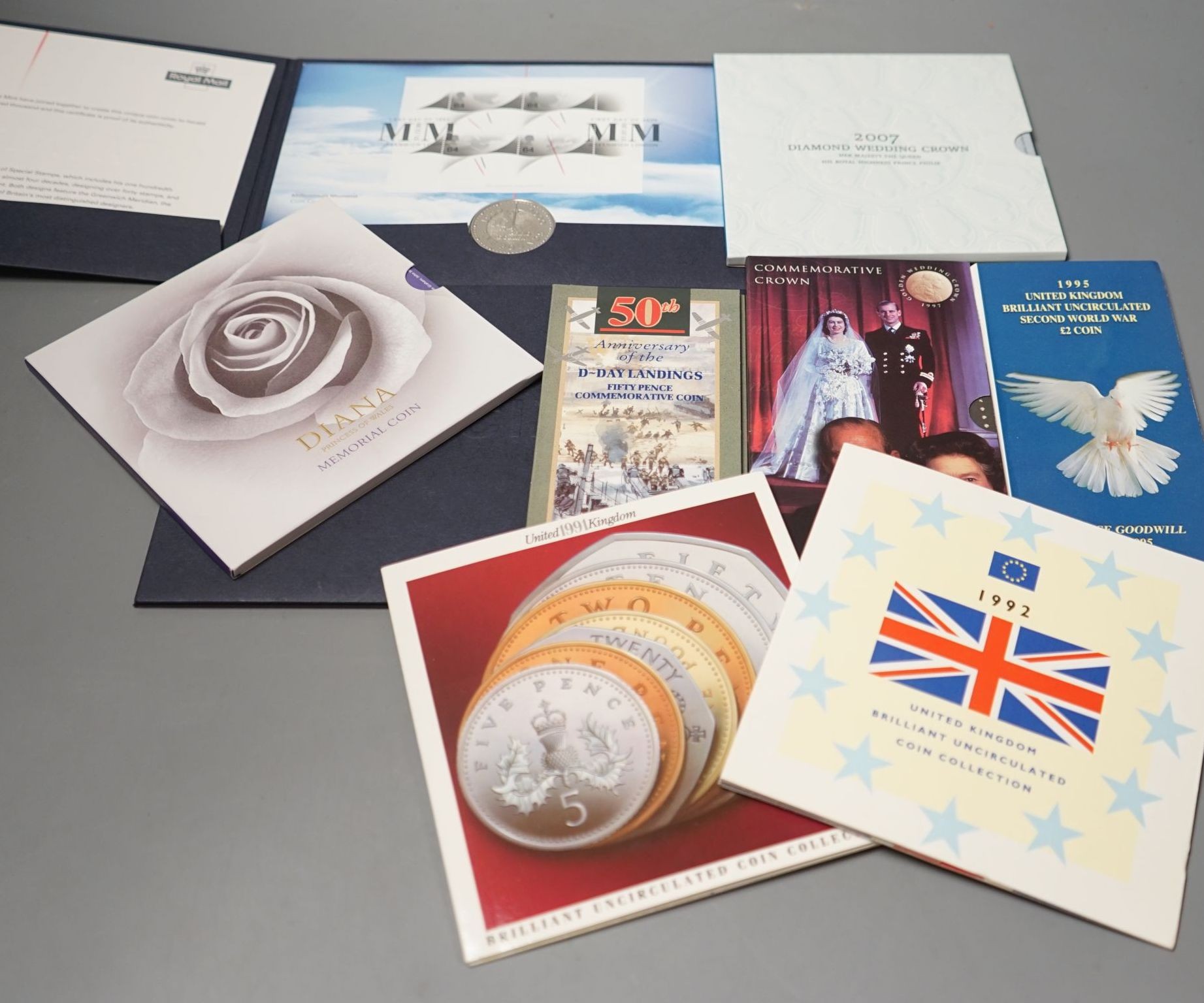 A collection of QEII Royal Mint Brilliant Uncirculated coins, 1992 onwards including various commemorative crowns, £2, 50 pence coins etc.